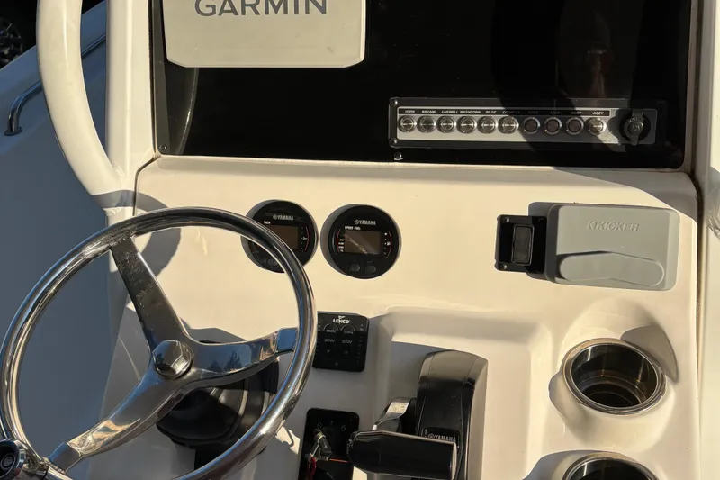 Slide: The Image of 2018 Tidewater 232 LXF boat dashboard with Garmin display and Yamaha gauges. - 15