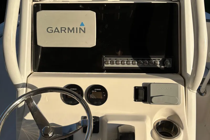 Slide: The Image of Control panel of 2018 Tidewater 232 LXF boat with Garmin display and Yamaha gauges. - 18