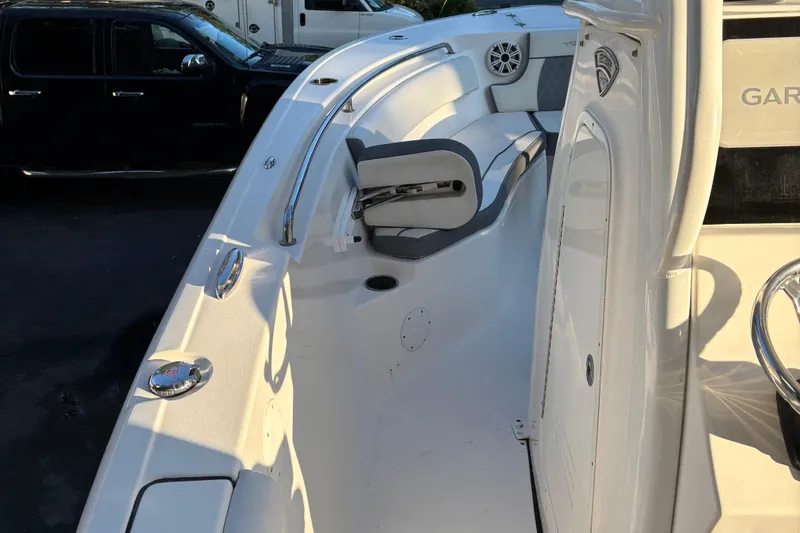 Slide: The Image of 2018 Tidewater 232 LXF boat interior with seating and stainless steel railings. - 22