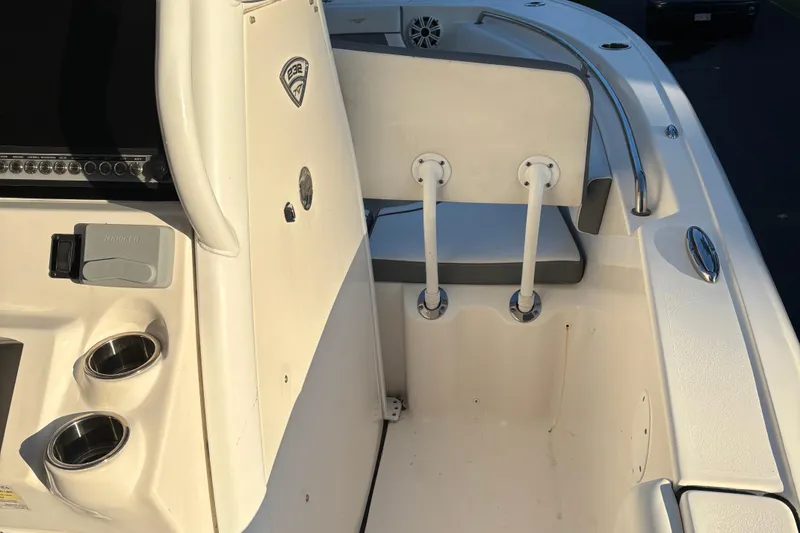 Slide: The Image of 2018 Tidewater 232 LXF boat interior with seating and cup holders. - 23
