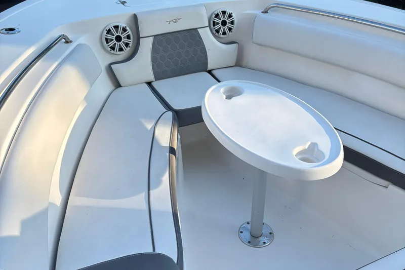 Slide: The Image of 2018 Tidewater 232 LXF boat interior with seating and table. - 26
