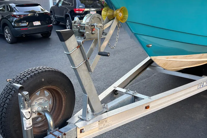 Slide: The Image of 2018 Tidewater 232 LXF boat on trailer, parked in driveway. - 4