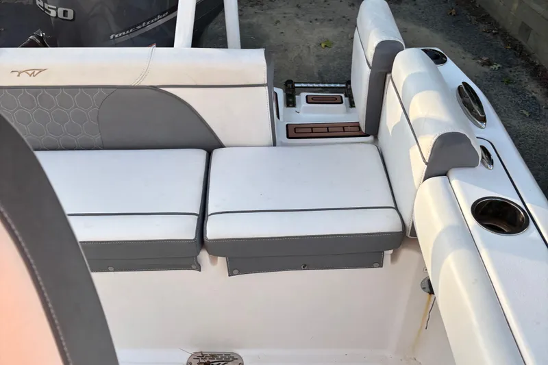 Slide: The Image of 2018 Tidewater 232 LXF boat interior seating with cup holders and stylish upholstery. - 6