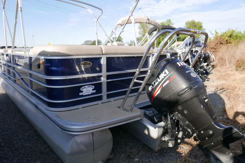 Slide: The Image of Pontoon boat Xcusrion x2312, 2012 model, with Suzuki outboard motor. - 3