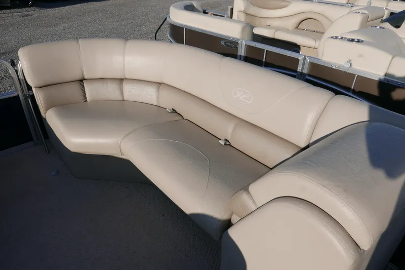 Slide: The Image of Beige leather seating on 2012 Xcusrion x2312 boat, featuring curved design. - 7