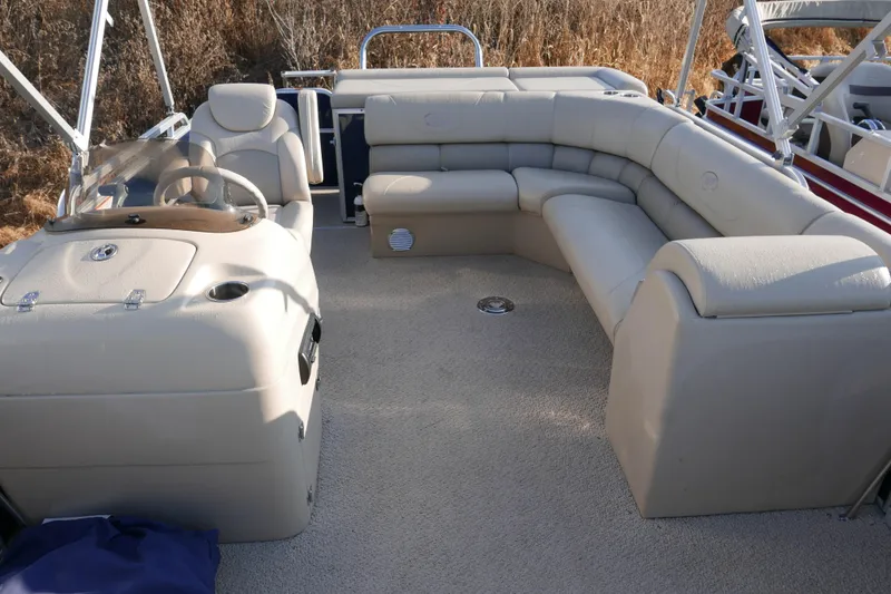 Slide: The Image of Luxurious 2012 Xcusrion x2312 boat interior with plush seating and steering console. - 8