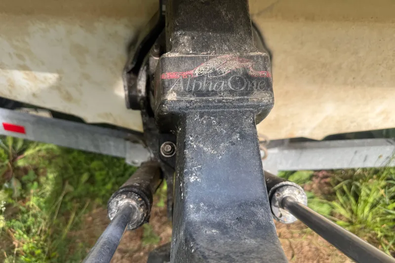 Slide: The Image of Close-up of a 1991 Sea Ray 220 Alpha One outdrive, showing mechanical details. - 13