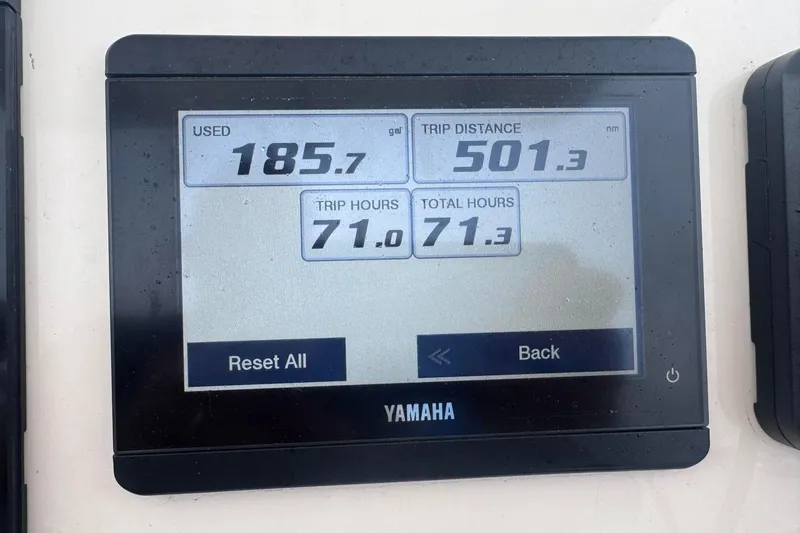 Slide: The Image of Yamaha display showing fuel usage, trip distance, and hours for 2024 Cobia 220 Center Console. - 10