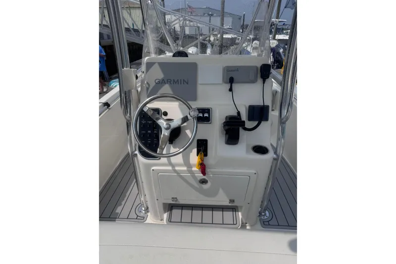 Slide: The Image of 2024 Cobia 220 Center Console boat dashboard with Garmin navigation system. - 4