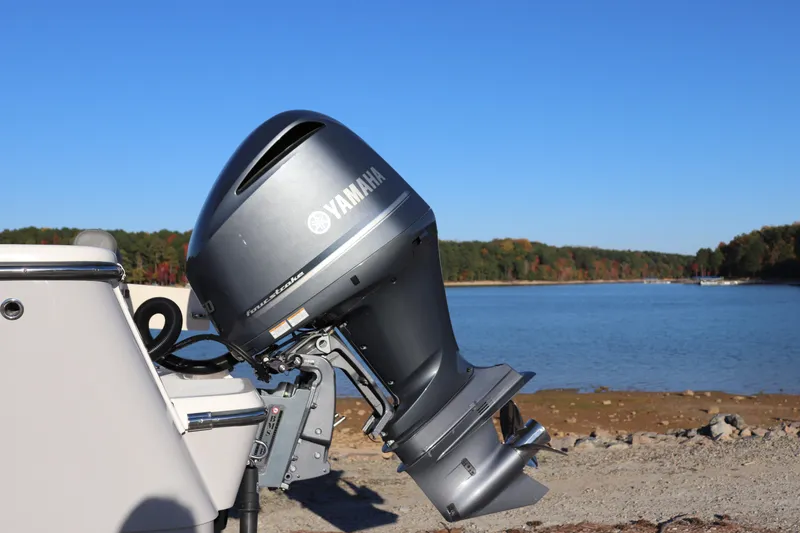 Slide: The Image of 2024 Sea Born LX22 Center Console with Yamaha outboard motor by a scenic lake. - 17