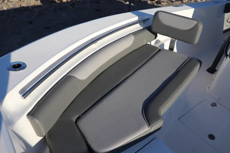 Slide: The Image of 2024 Sea Born LX22 Center Console boat seating with gray cushions and sleek design. - 2