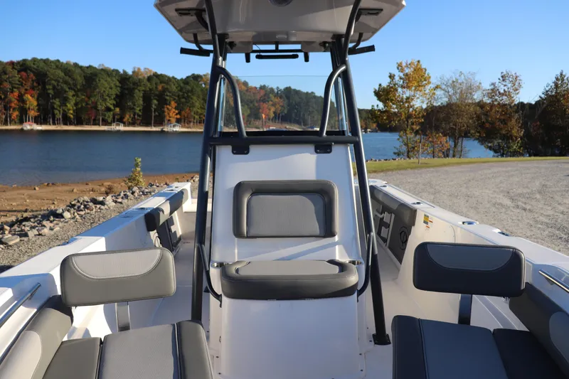 Slide: The Image of 2024 Sea Born LX22 Center Console boat by a scenic lake. - 4