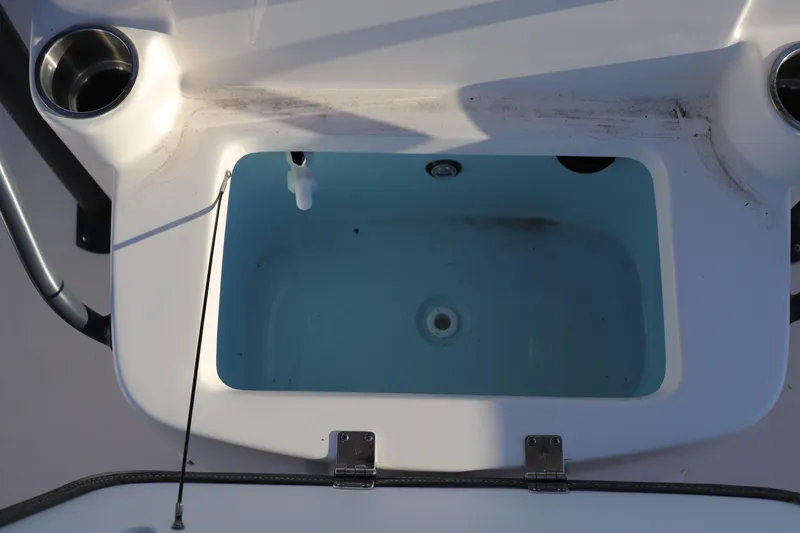 Slide: The Image of Livewell on 2024 Sea Born LX22 Center Console boat, featuring cup holders and clean design. - 6