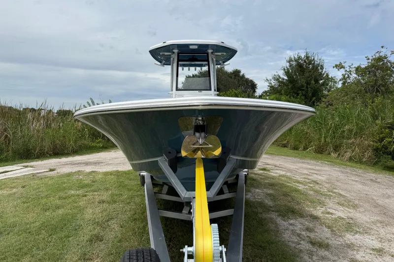 Slide: The Image of 2026 Tidewater 2700 Carolina Bay boat on trailer, front view, outdoors. - 11