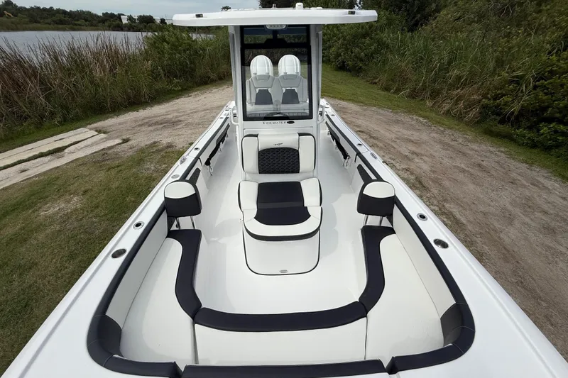 Slide: The Image of 2026 Tidewater 2700 Carolina Bay boat with sleek seating and spacious deck design. - 21