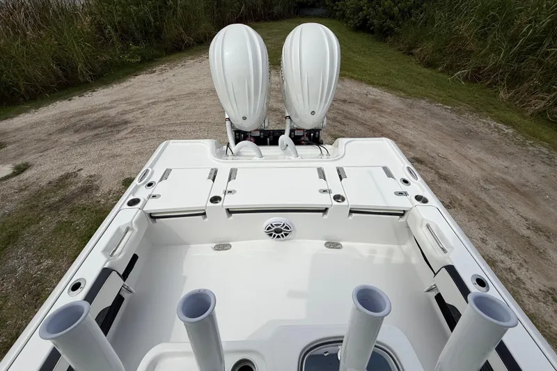 Slide: The Image of 2026 Tidewater 2700 Carolina Bay boat with dual engines and spacious deck layout. - 25