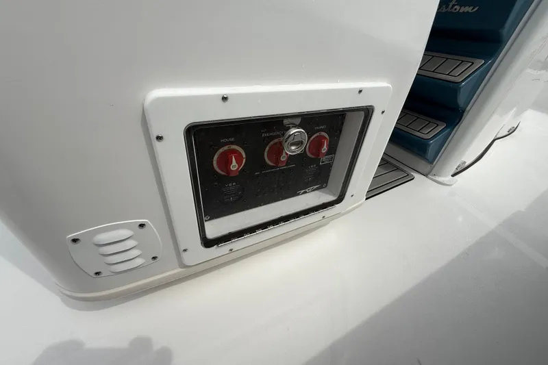 Slide: The Image of Control panel on 2026 Tidewater 2700 Carolina Bay boat, featuring switches and steps. - 35