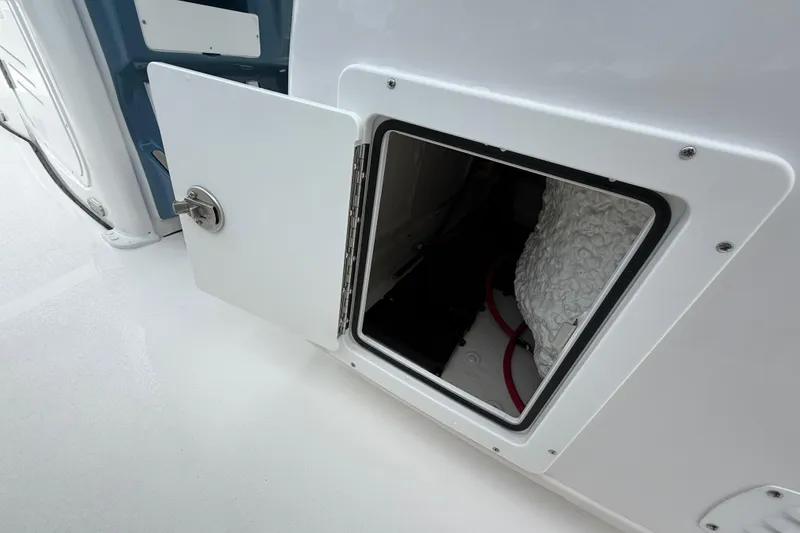 Slide: The Image of Open storage compartment on 2026 Tidewater 2700 Carolina Bay boat. - 37