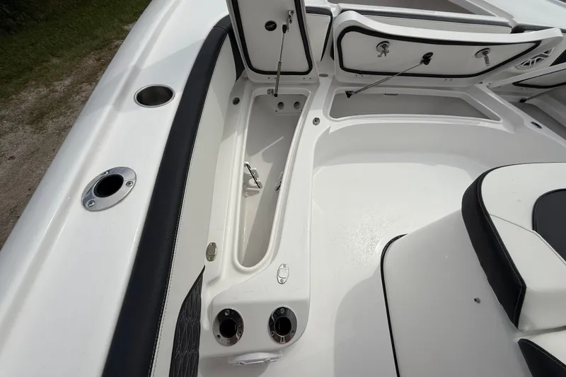 Slide: The Image of 2026 Tidewater 2700 Carolina Bay boat interior with storage compartments and seating. - 43