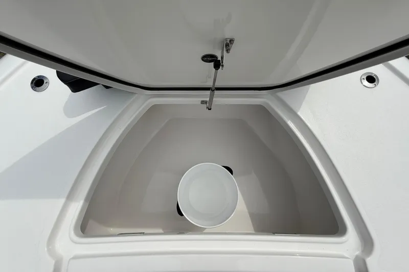 Slide: The Image of Open storage compartment on 2026 Tidewater 2700 Carolina Bay boat with bucket inside. - 46