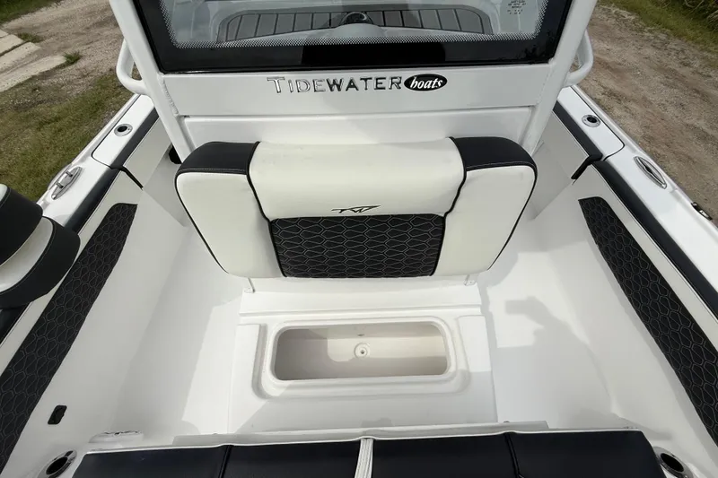 Slide: The Image of Tidewater 2700 Carolina Bay 2026 boat interior with seating and storage compartment. - 47