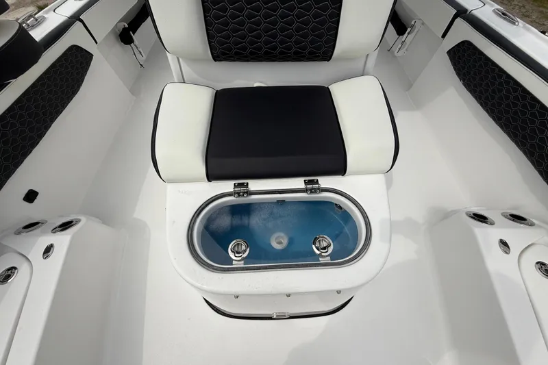 Slide: The Image of 2026 Tidewater 2700 Carolina Bay boat interior with seating and livewell. - 48