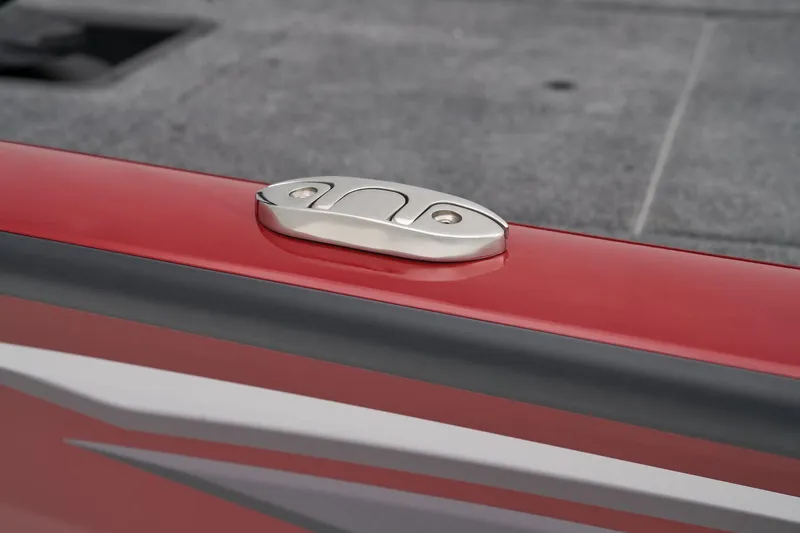 Slide: The Image of Manufacturer Provided Image: 2025 Tracker Pro Team 175 boat cleat on red surface, close-up view. - 55