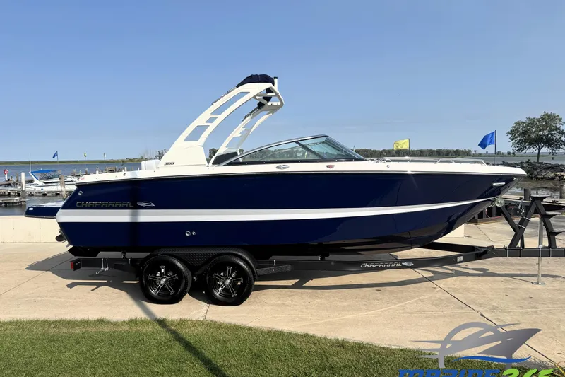 The Image of 2025 Chaparral 247 SSX boat on trailer by lakeside dock. - 0