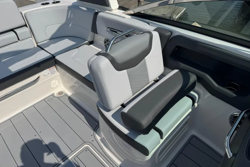 Slide: The Image of 2025 Chaparral 247 SSX boat interior with modern seating and sleek design. - 12