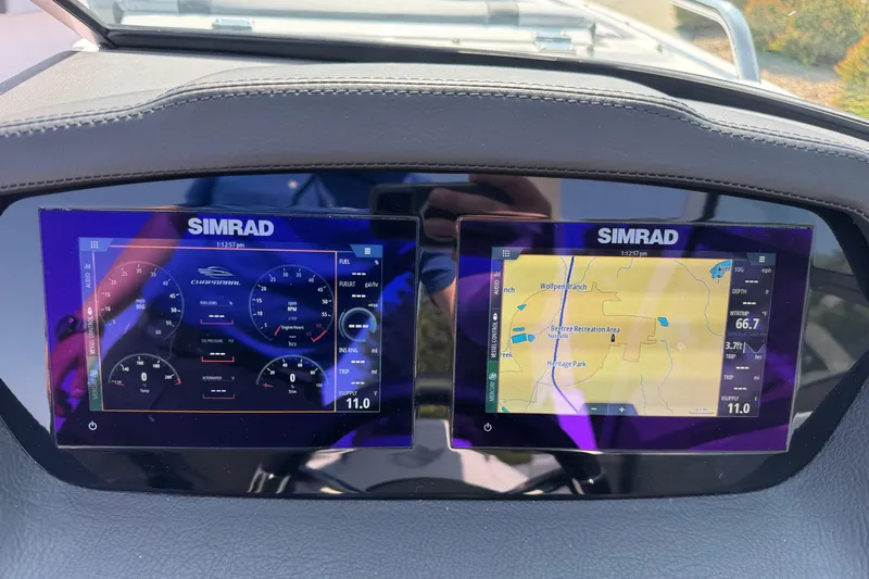 Slide: The Image of Dashboard of 2025 Chaparral 247 SSX with dual Simrad displays showing navigation and gauges. - 14
