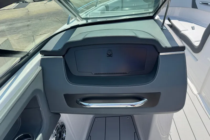 Slide: The Image of 2025 Chaparral 247 SSX boat dashboard with sleek design and modern features. - 20
