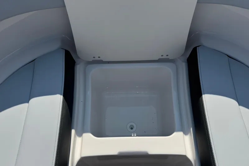 Slide: The Image of Interior storage compartment of 2025 Chaparral 247 SSX boat, featuring sleek seating design. - 26