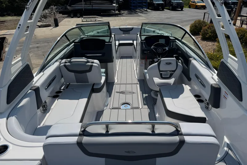 Slide: The Image of 2025 Chaparral 247 SSX boat interior with sleek seating and modern dashboard design. - 33