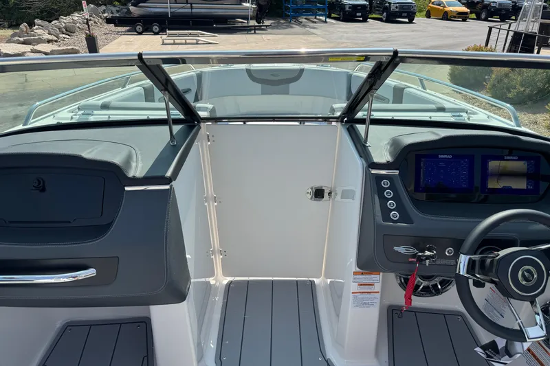 Slide: The Image of 2025 Chaparral 247 SSX boat interior with modern dashboard and steering wheel. - 36