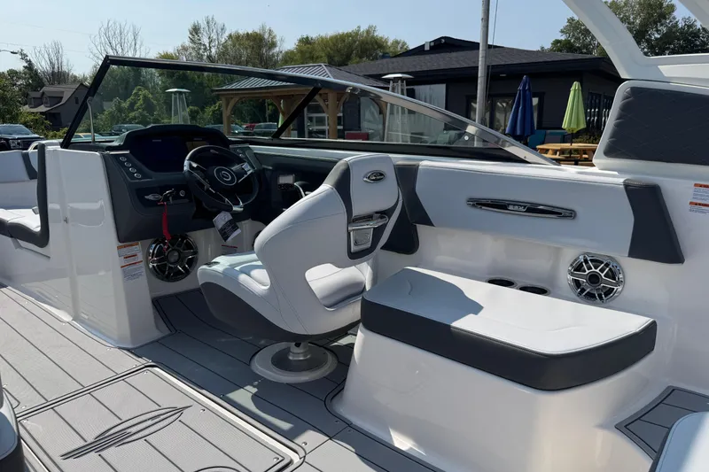 Slide: The Image of 2025 Chaparral 247 SSX boat interior with modern helm, seating, and sleek design. - 43