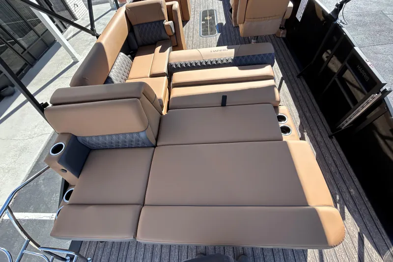 Slide: The Image of 2026 Harris FloteBote Cruiser 230 SL interior with luxurious tan seating and cup holders. - 15