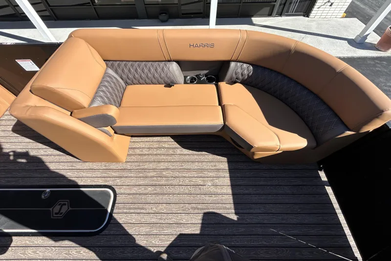 Slide: The Image of Luxurious seating on 2026 Harris FloteBote Cruiser 230 SL with tan and gray upholstery. - 20