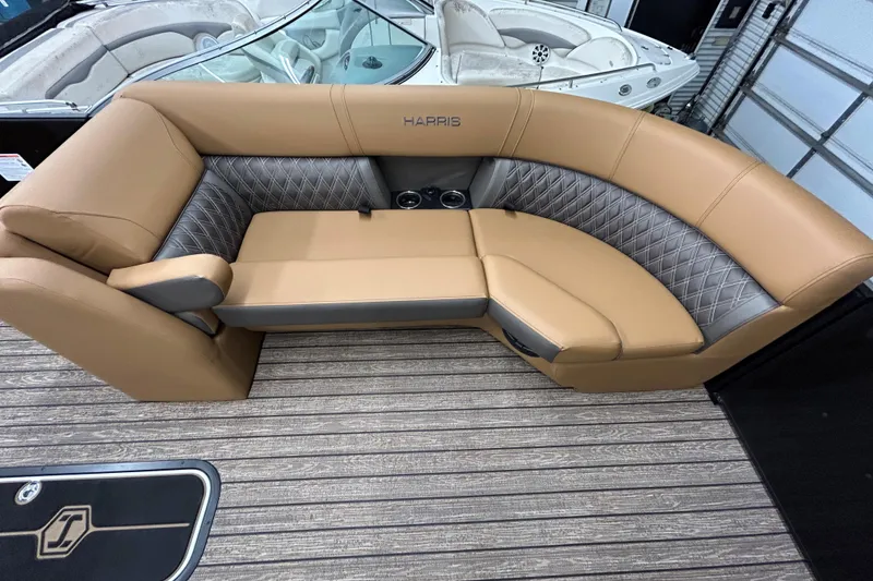 Slide: The Image of 2026 Harris FloteBote Cruiser 230 SL pontoon boat at a marina parking lot. - 5