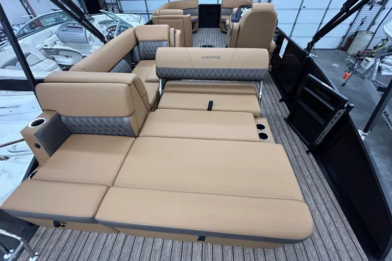 Slide: The Image of 2026 Harris FloteBote Cruiser 230 SL pontoon boat at dealership, featuring sleek design and powerful engine. - 6