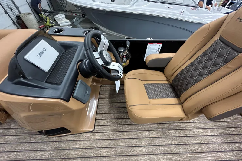 Slide: The Image of 2026 Harris FloteBote Cruiser 230 SL pontoon boat at a marine dealership. - 7