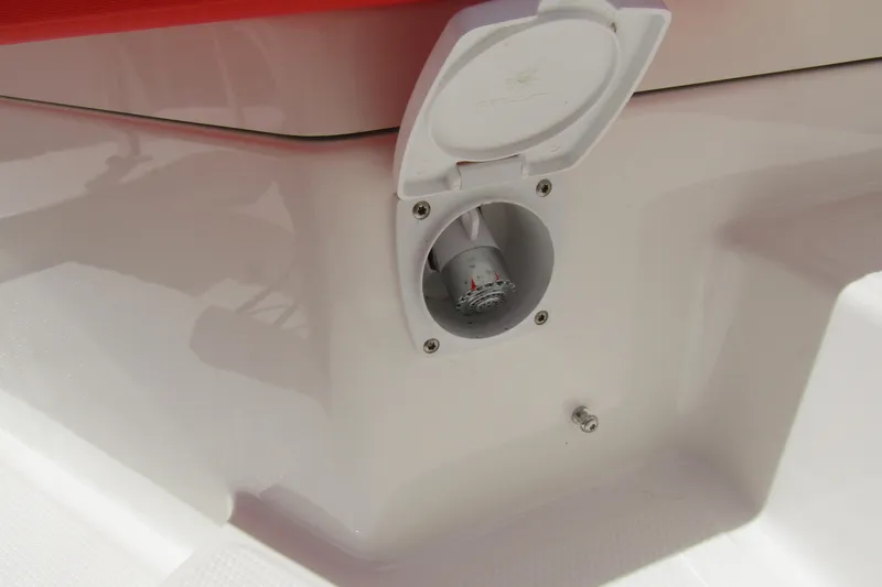 Slide: The Image of 2024 Nimbus T8 boat detail showing a water outlet with a protective cover. - 32