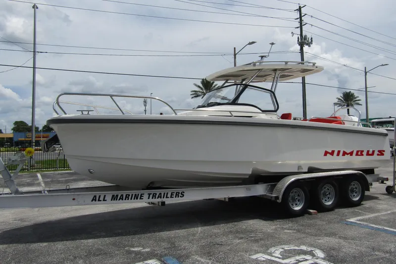 Slide: The Image of 2024 Nimbus T8 boat on trailer in parking lot, side view. - 6
