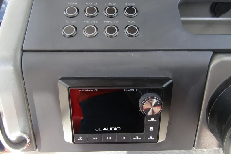 Slide: The Image of Control panel of 2024 Nimbus T8 with JL Audio MediaMaster display and various function buttons. - 18