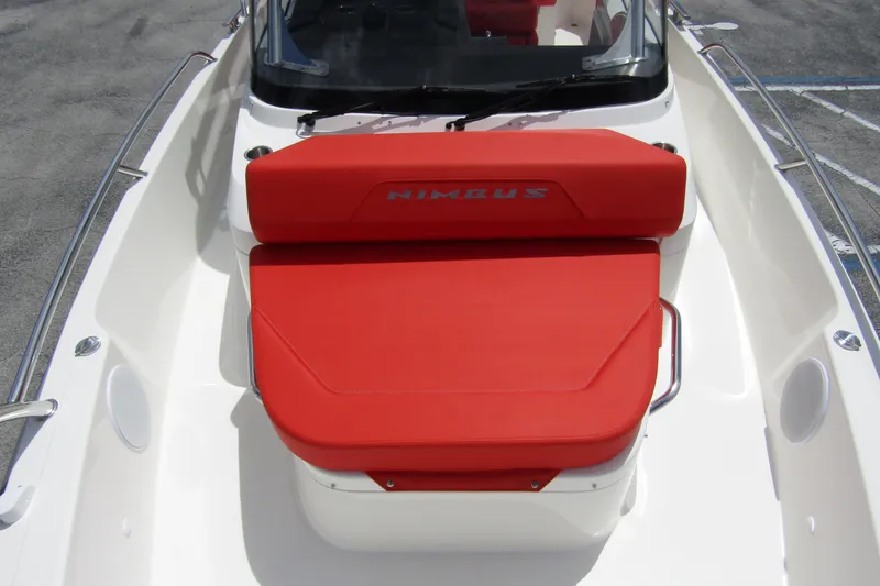 Slide: The Image of 2024 Nimbus T8 boat with red seating and sleek design. - 11
