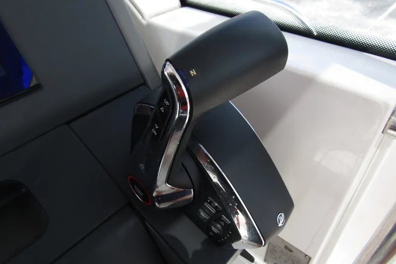 Slide: The Image of Throttle control of 2024 Nimbus T8 boat, featuring sleek design and ergonomic handle. - 19