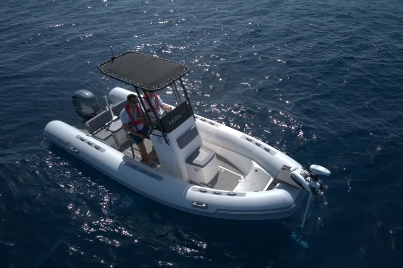 Slide: The Image of 2026 Northstar Vega 5.8 boat cruising on open water. - 3