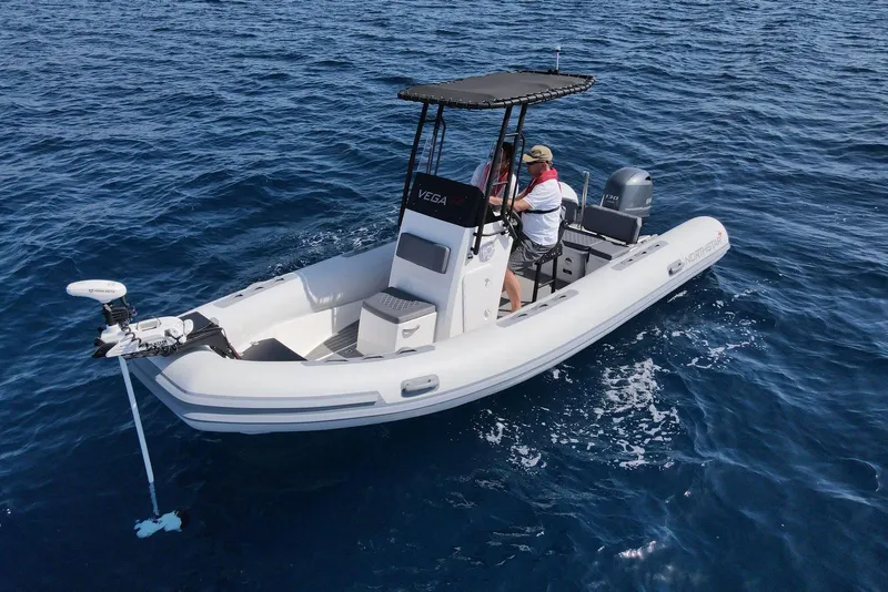 Slide: The Image of 2026 Northstar Vega 5.8 boat on open water, featuring modern design and equipment. - 5