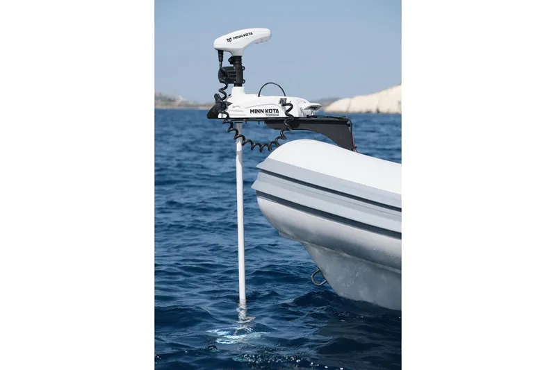 Slide: The Image of Northstar Vega 5.8 boat with Minn Kota motor in blue ocean, 2026 model. - 7