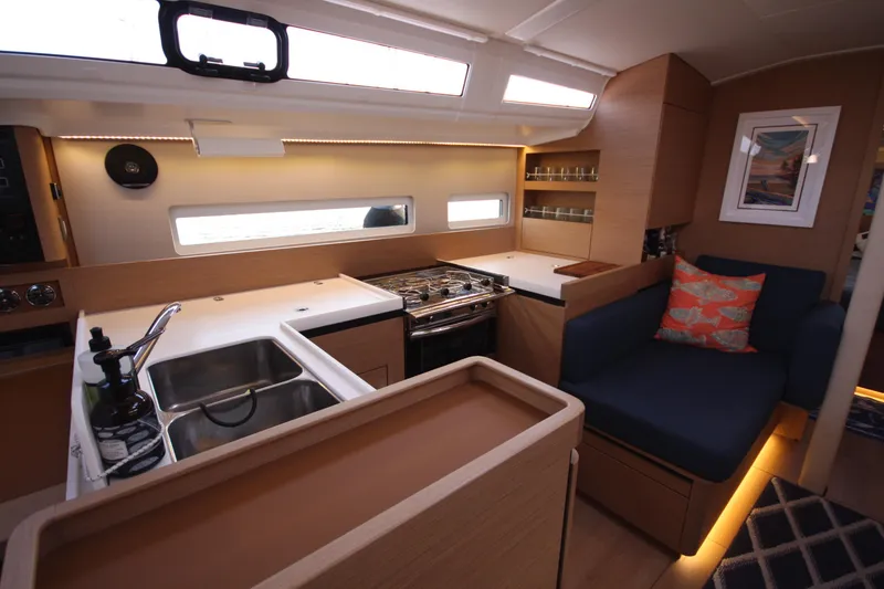 Slide: The Image of Modern kitchen interior of 2022 Jeanneau Sun Odyssey 410 yacht with cozy seating. - 13