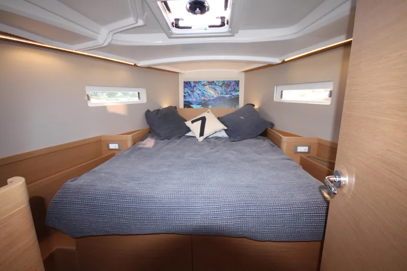Slide: The Image of Luxurious cabin interior of 2022 Jeanneau Sun Odyssey 410 yacht with cozy bedding. - 19